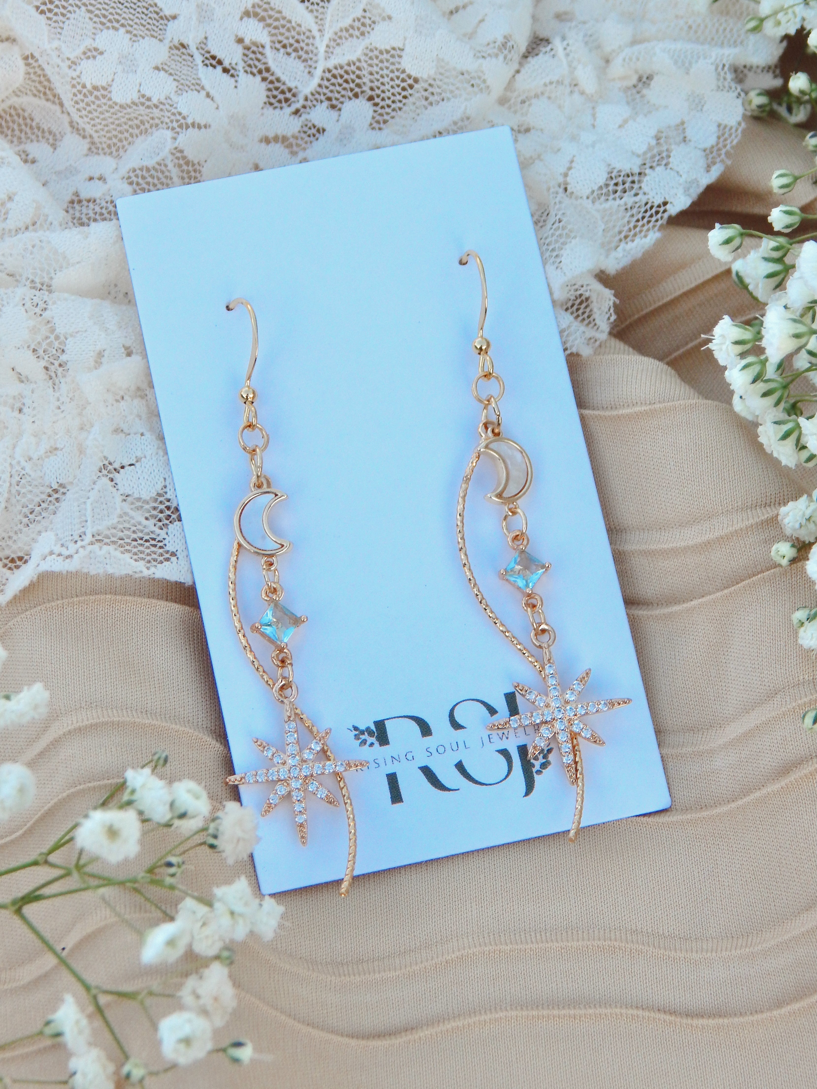 Celestial Cascade Earrings – Gold Star & Moon Dangles with CZ, Mother of Pearl & Twisted Bar Accent