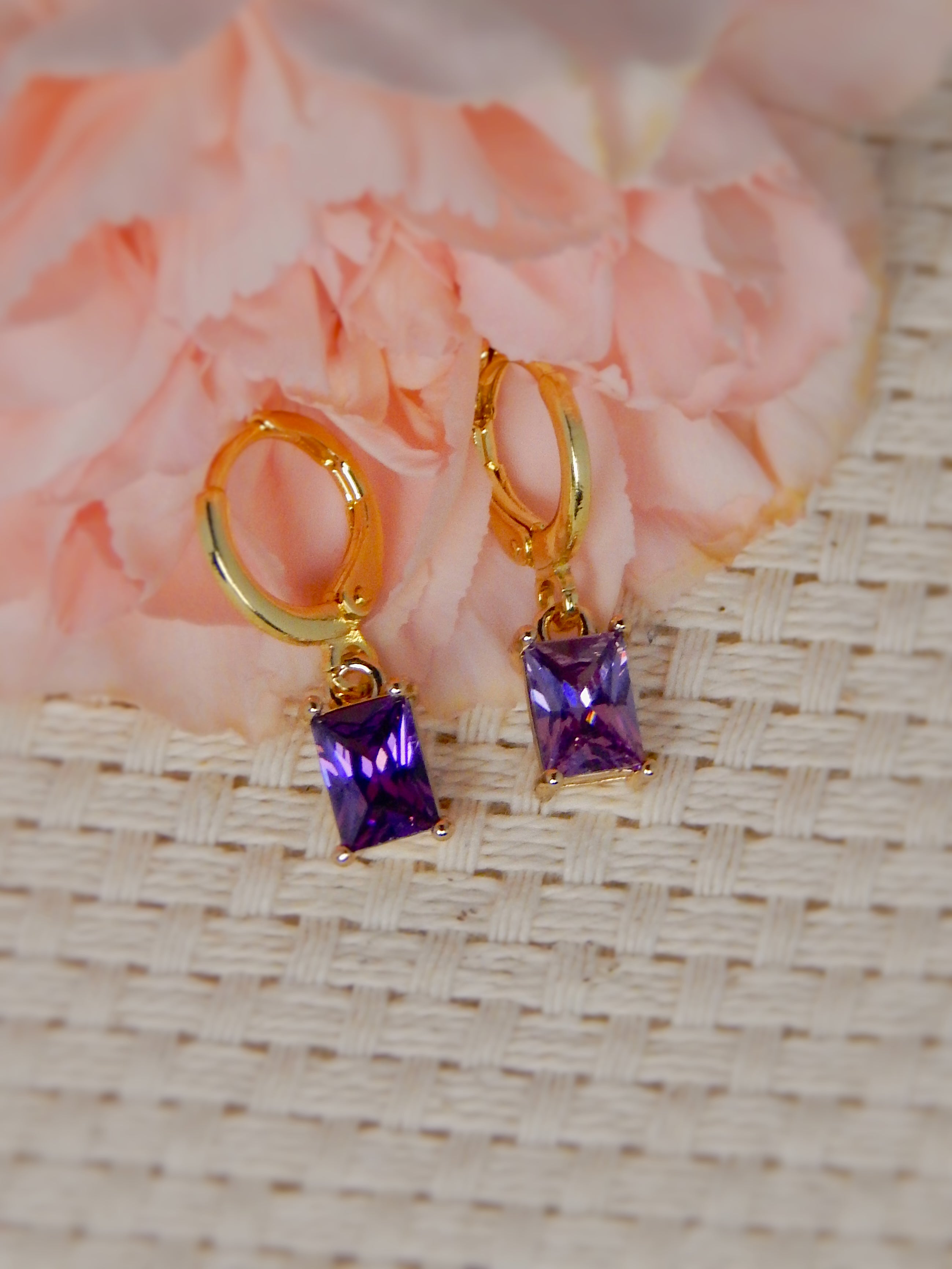 Gold huggie earrings with purple rectangular gemstone drop earrings