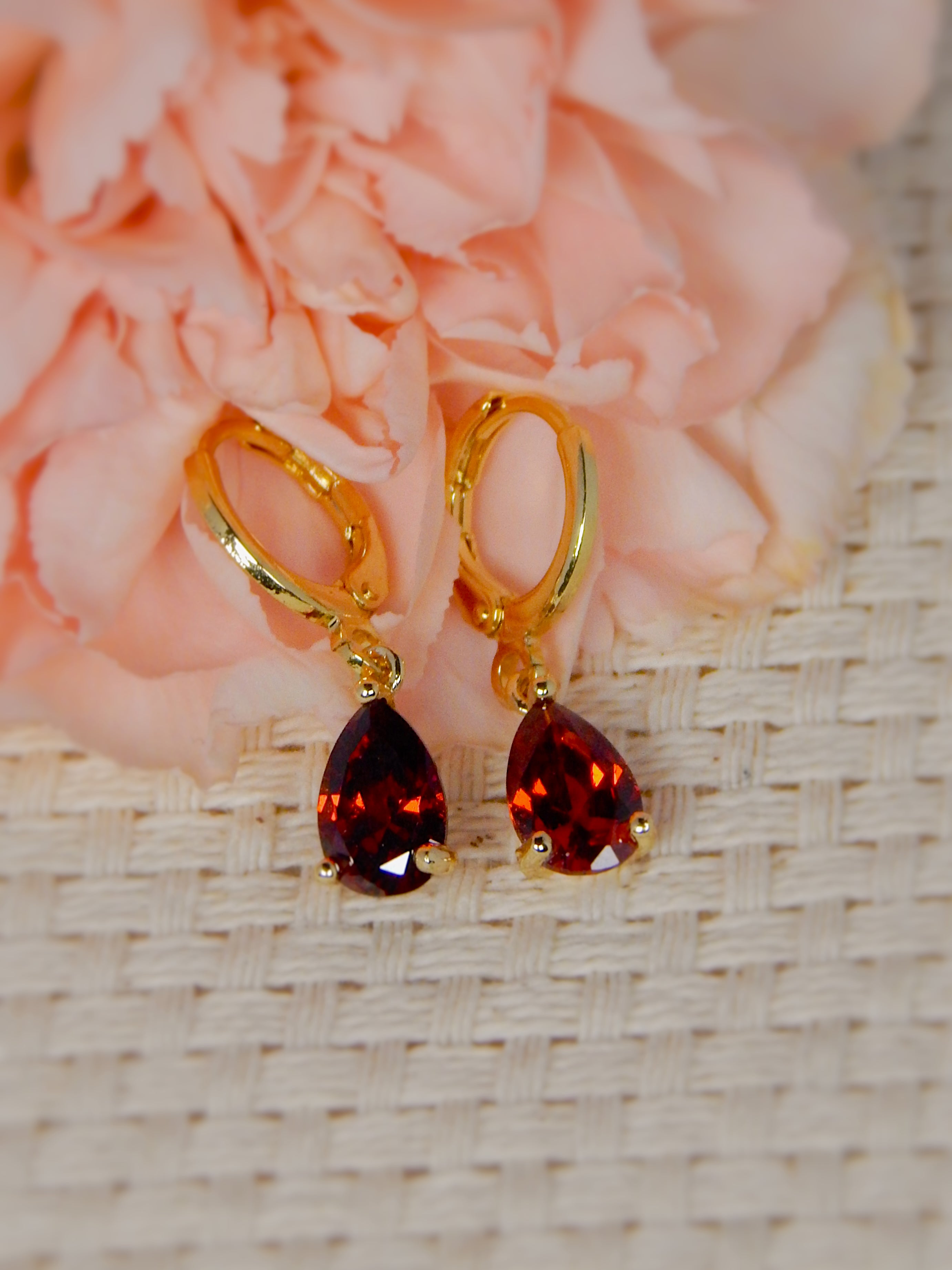 Gold huggie earrings with red teardrop gemstone drop, bold feminine statement earrings