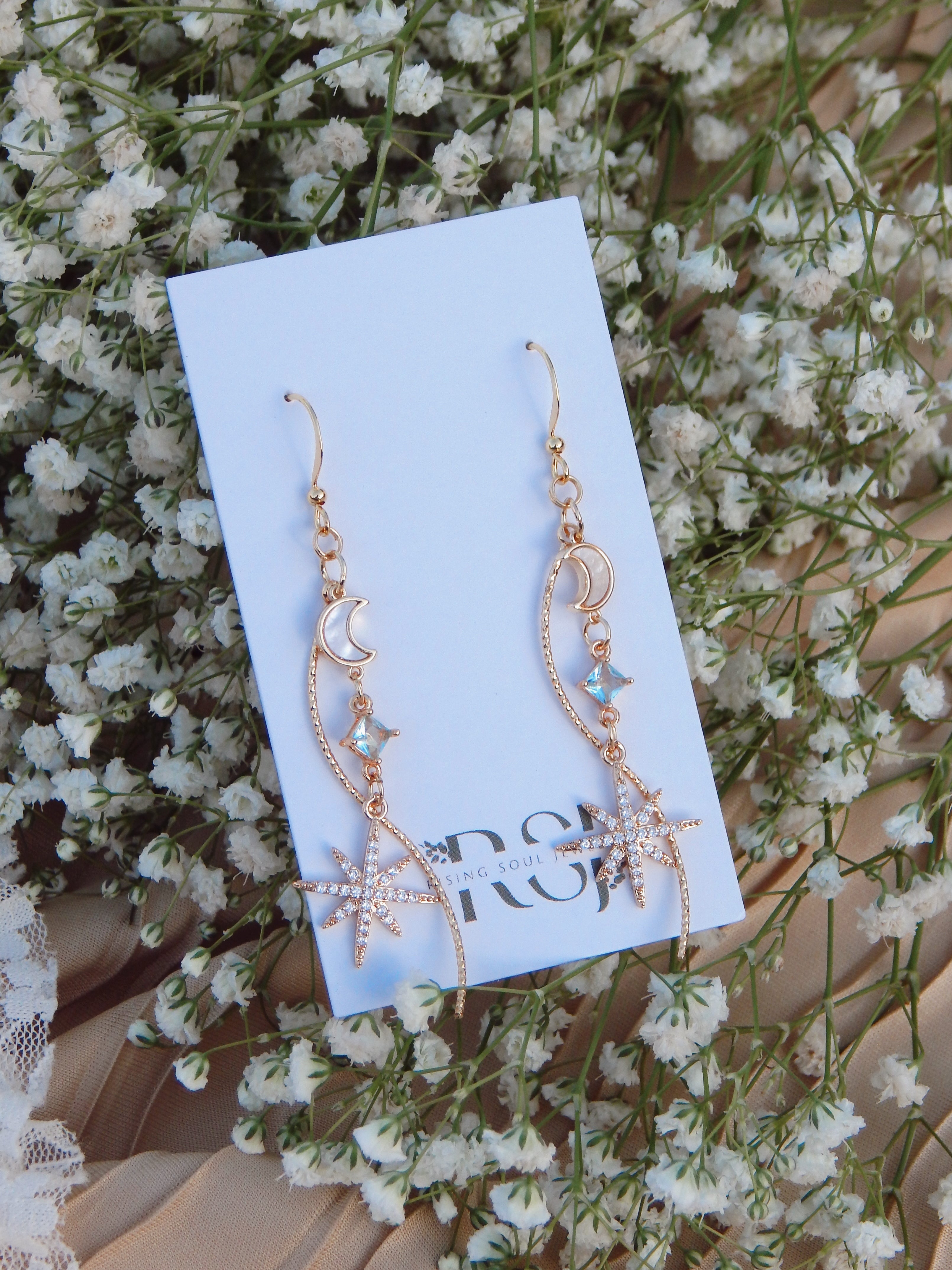 Celestial Cascade Earrings – Gold Star & Moon Dangles with CZ, Mother of Pearl & Twisted Bar Accent
