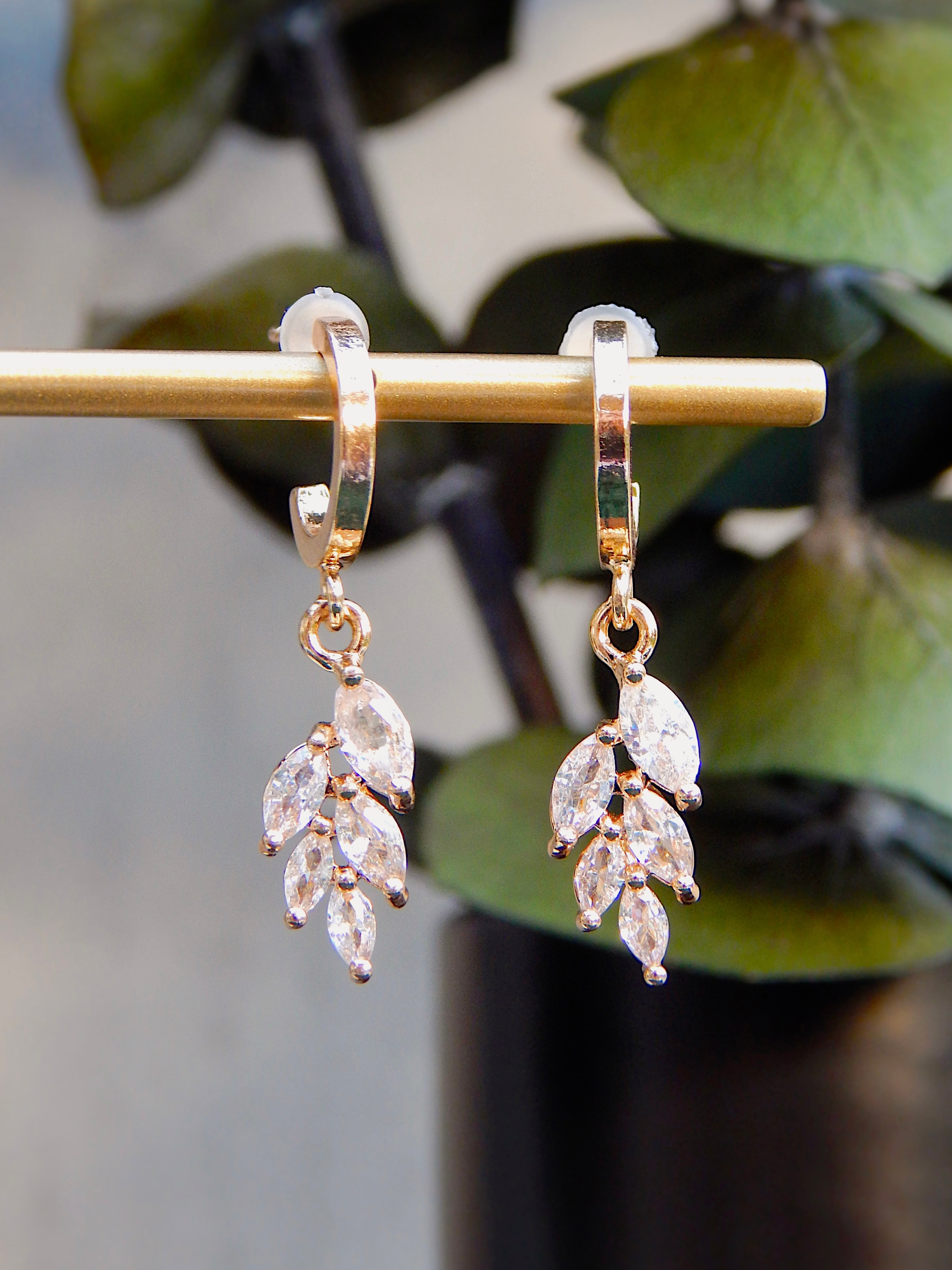 Gold Ivy huggie earrings with cascading CZ leaf dangle, delicate nature-inspired jewelry