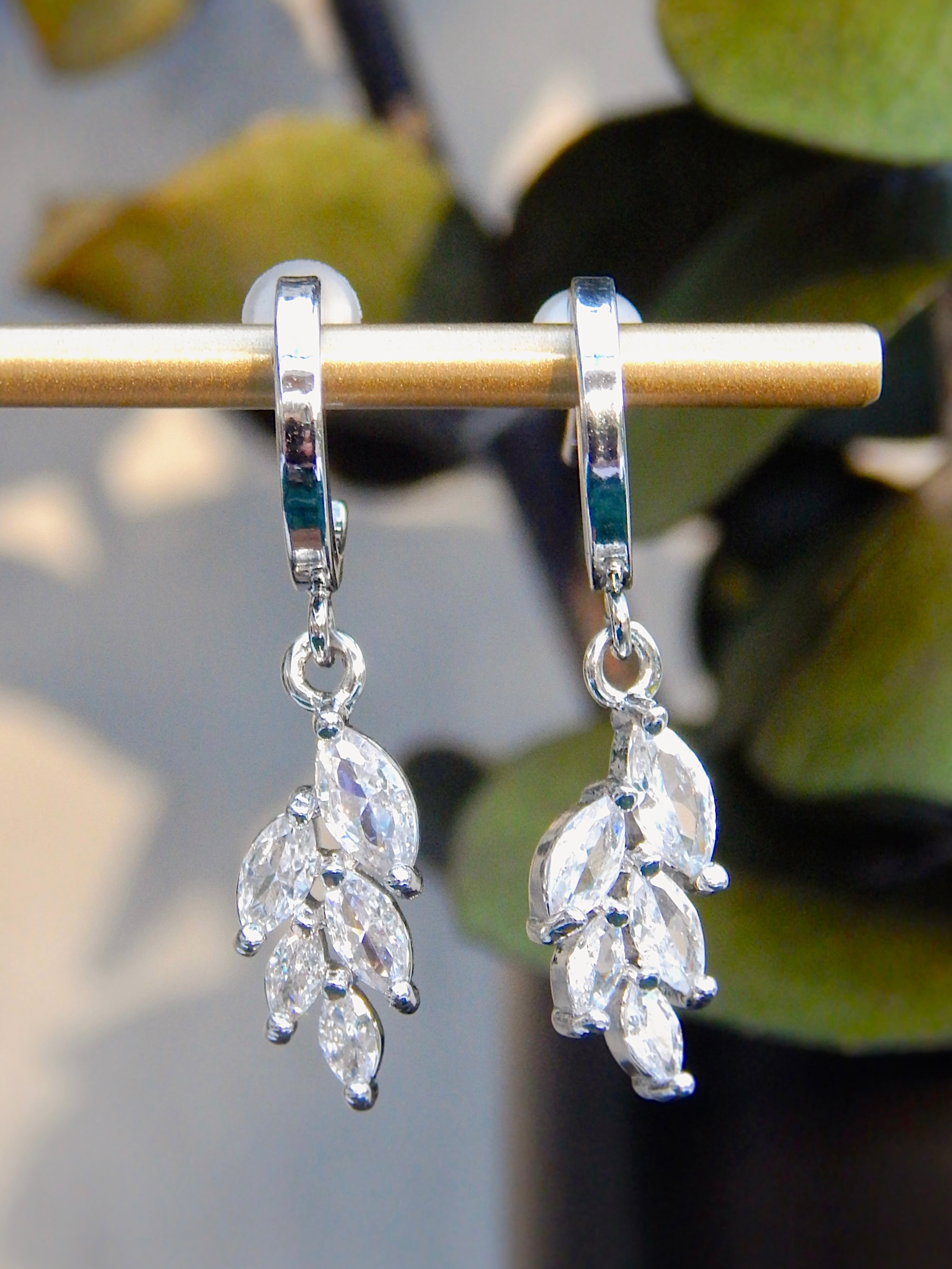 Silver Ivy huggie earrings with sparkling CZ leaf dangle, minimalist nature-inspired drop earrings