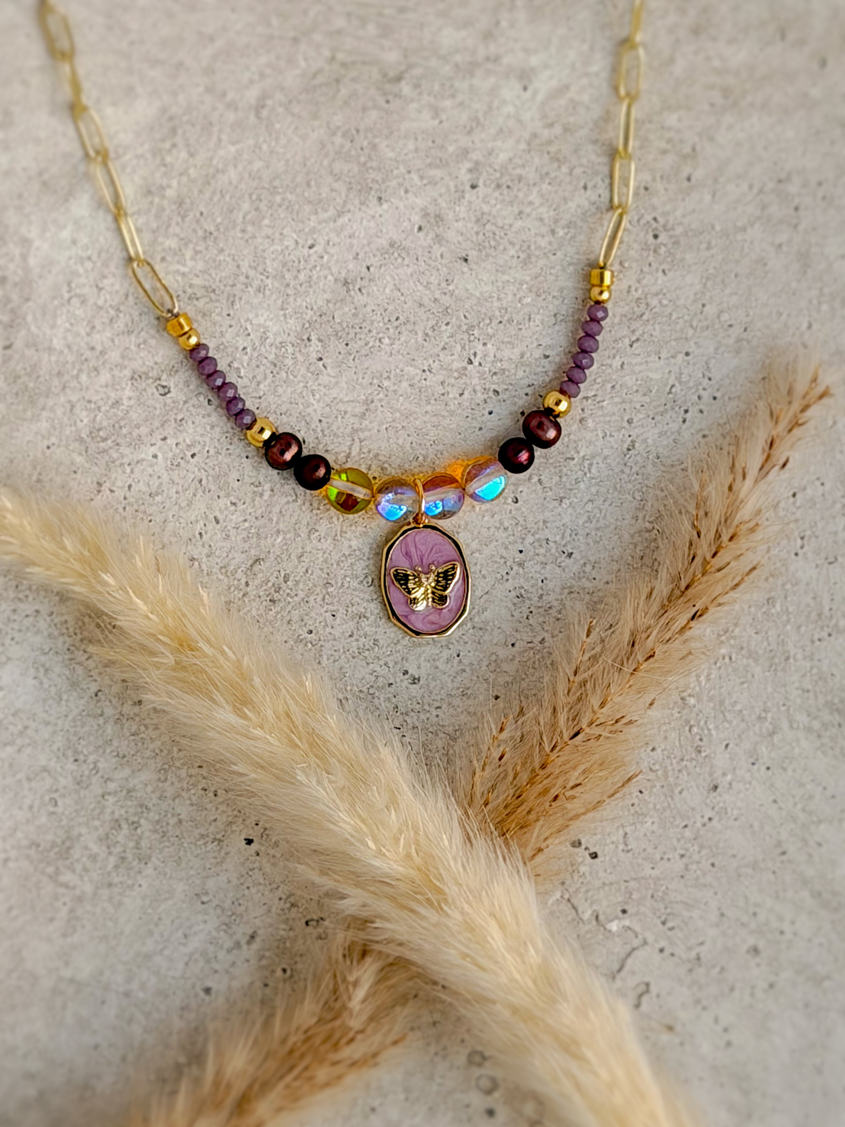 One of a Kind Twilight Butterfly Necklace with natural gemstones, iridescent crystal beads, lavender butterfly charm, and gold paperclip chain handcrafted by Rising Soul Jewelry.