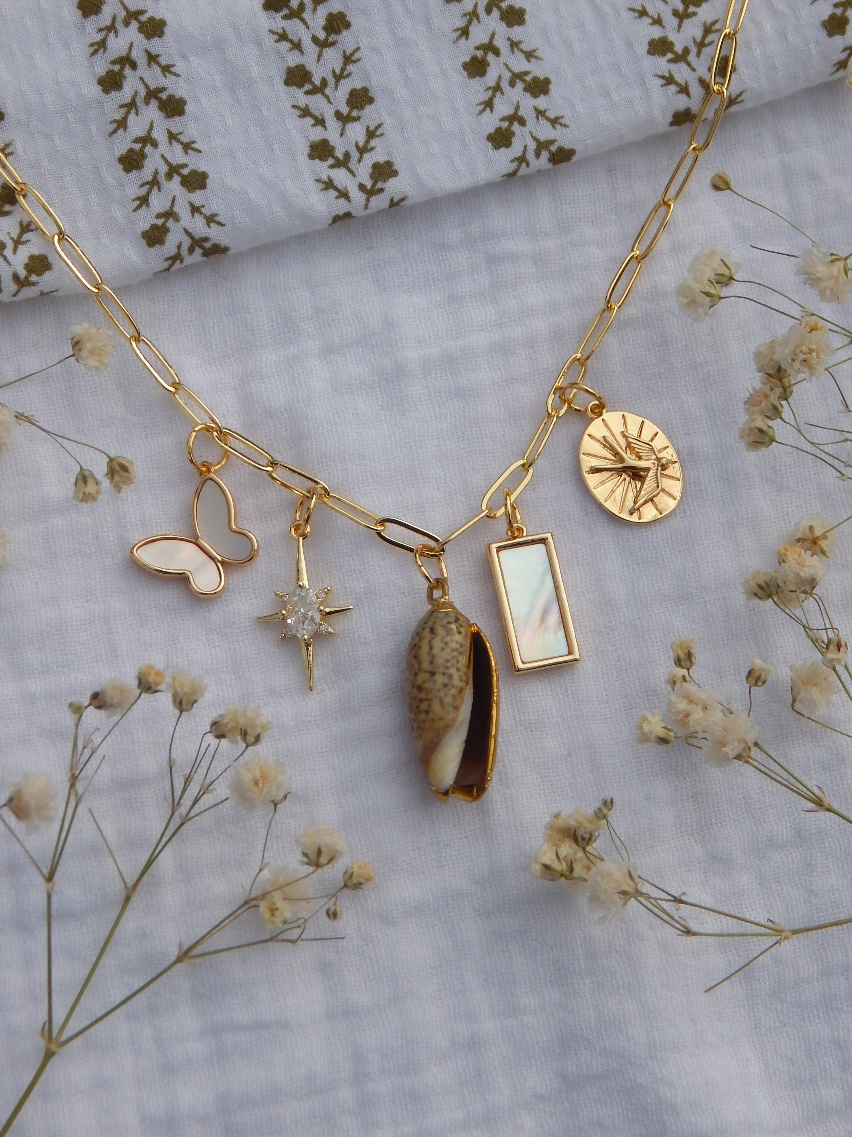 One-of-a-Kind Coastal Charm Necklace | Mother of Pearl Butterfly | CZ North Star | Natural Seashell Pendant | Bird Charm | 18” Gold Paperclip Chain