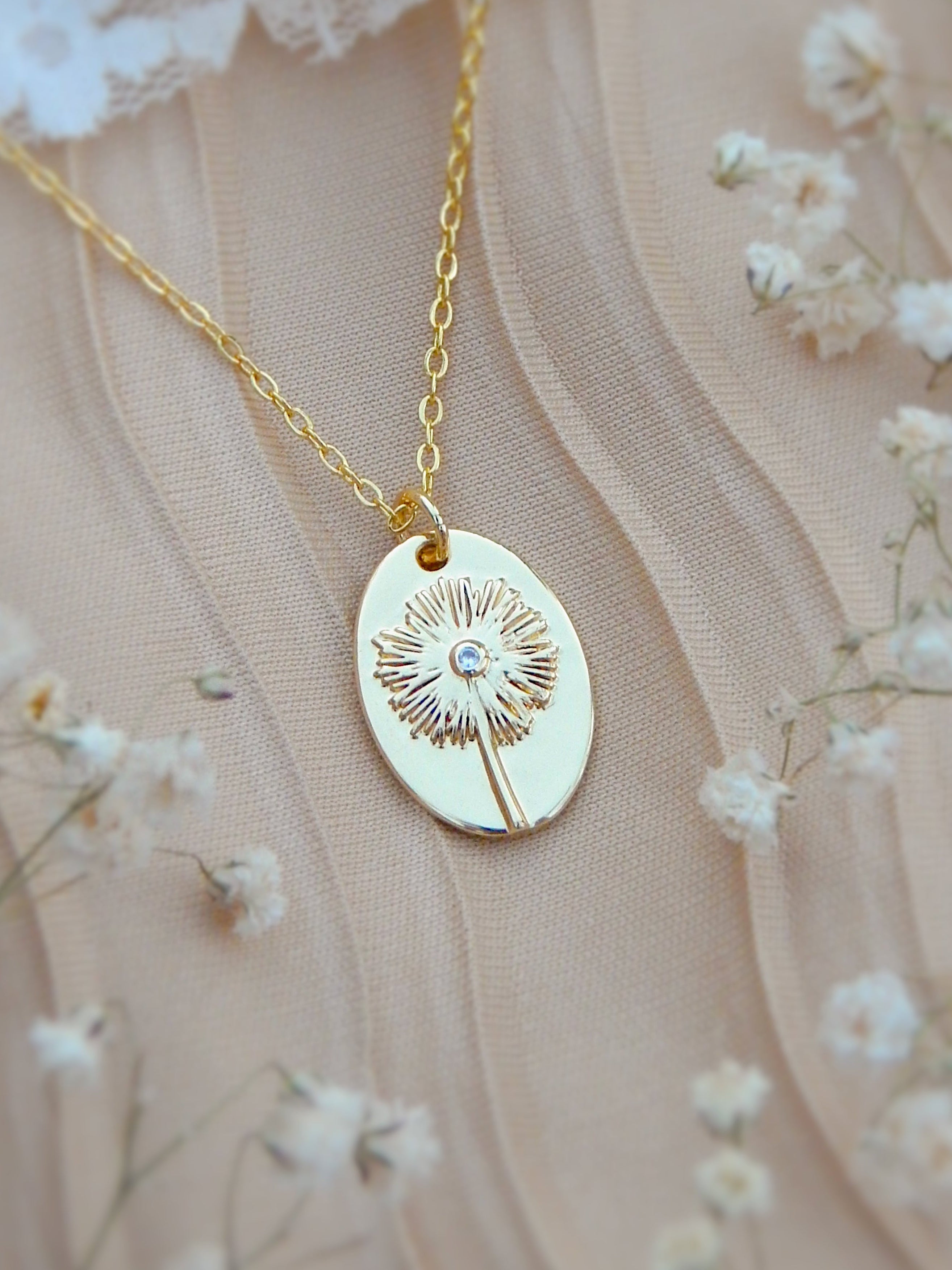 Gold dandelion wish necklace with engraved sunburst dandelion pendant on dainty chain