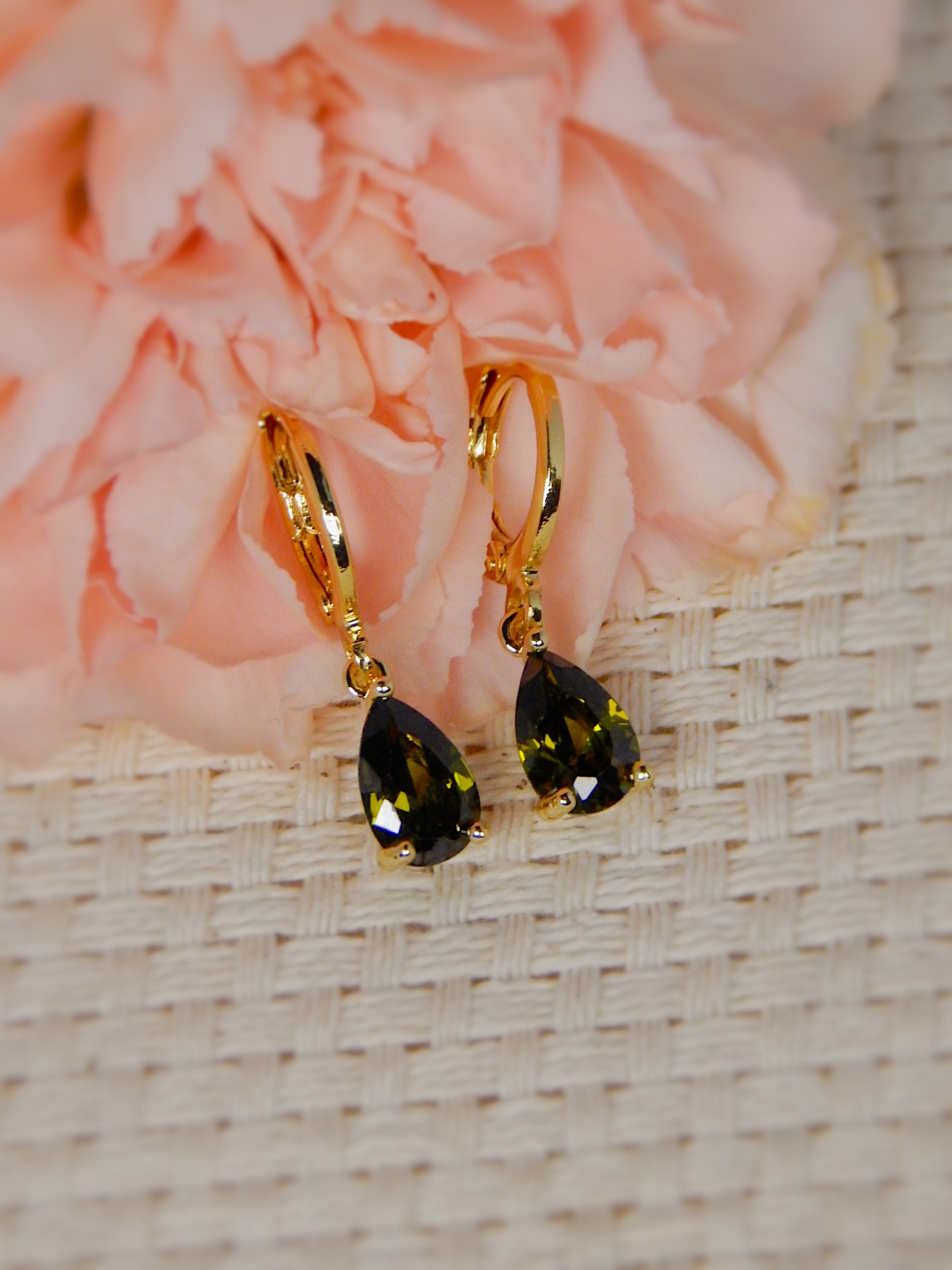 Gold huggie earrings with black teardrop gemstone drop, elegant statement jewelry