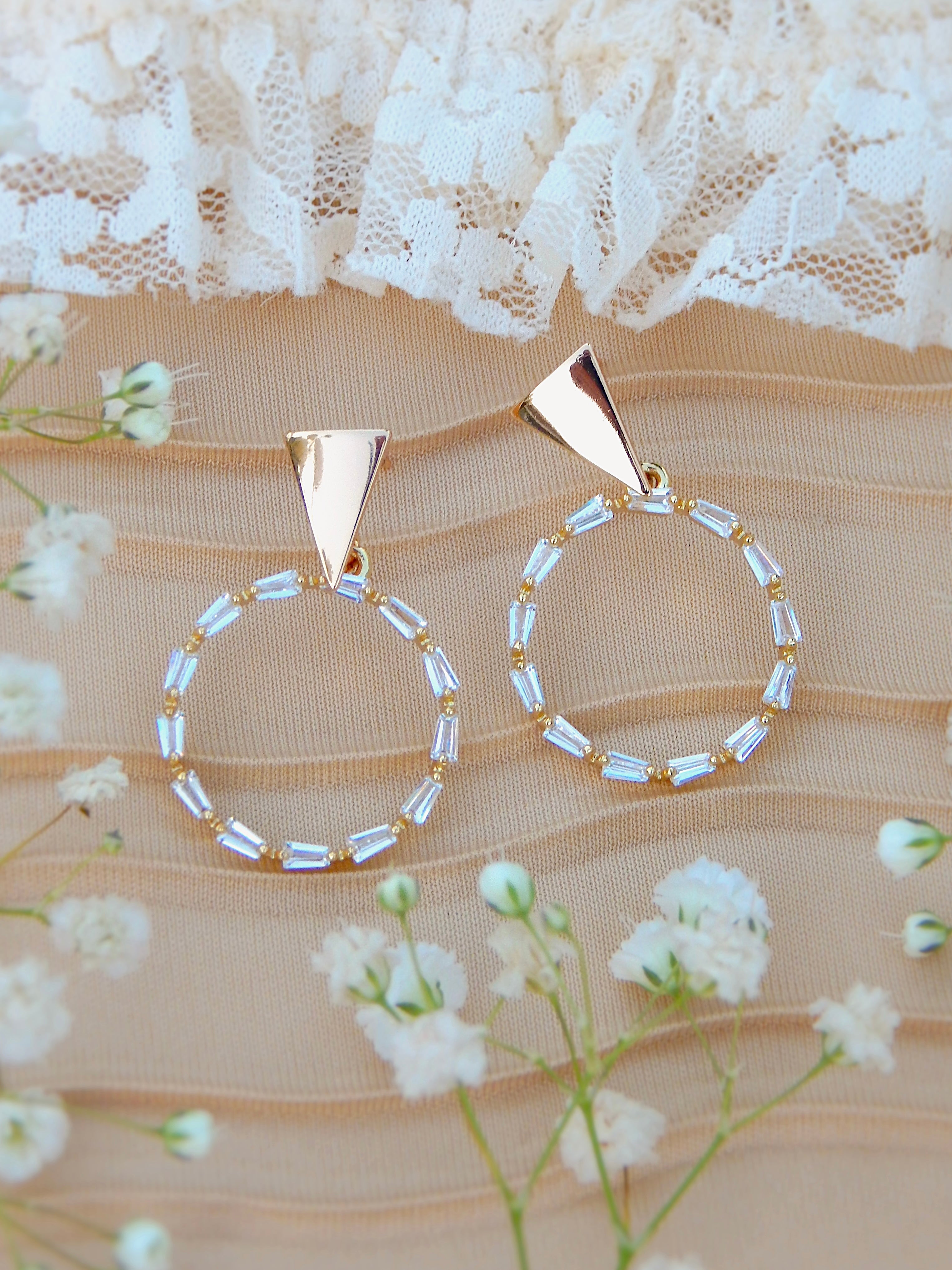 Gold circle drop earrings with baguette cubic zirconia, radiant statement hoop design with sparkling detail